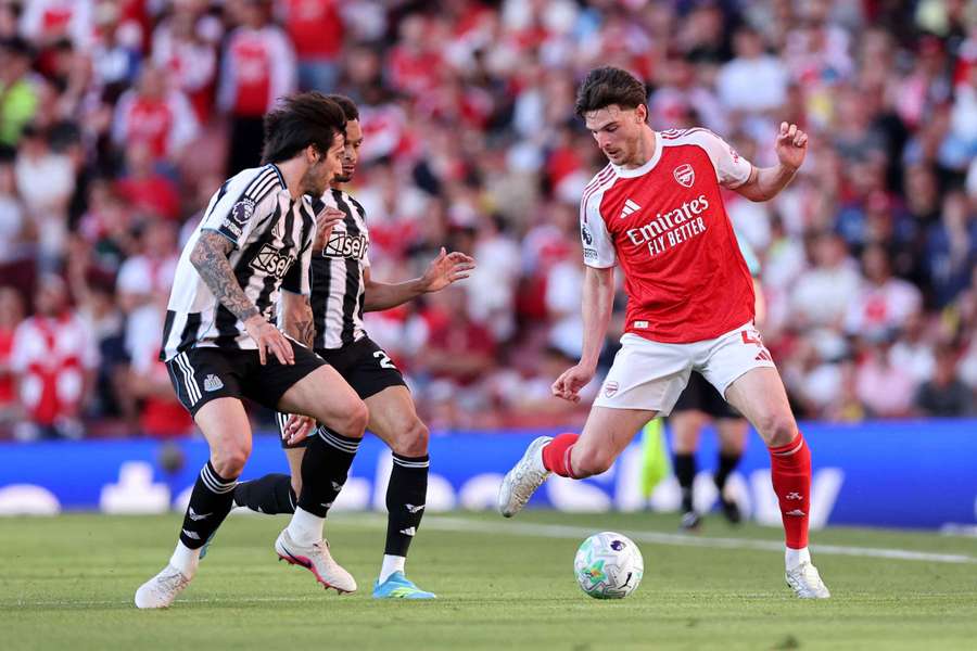 Arsenal's Declan Rice in action with Newcastle United's Sandro Tonali and Jacob Murphy 
