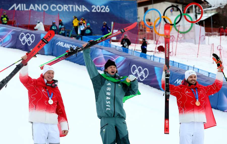 Gold medallist Lucas Pinheiro Braathen of Brazil celebrates on the podium after winning the men's giant slalom