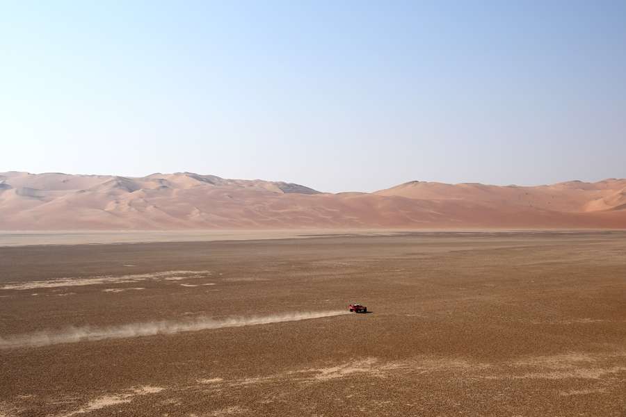 Loeb drives through the sand in Dakar