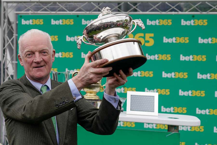 Willie Mullins with the trophy at Sandown
