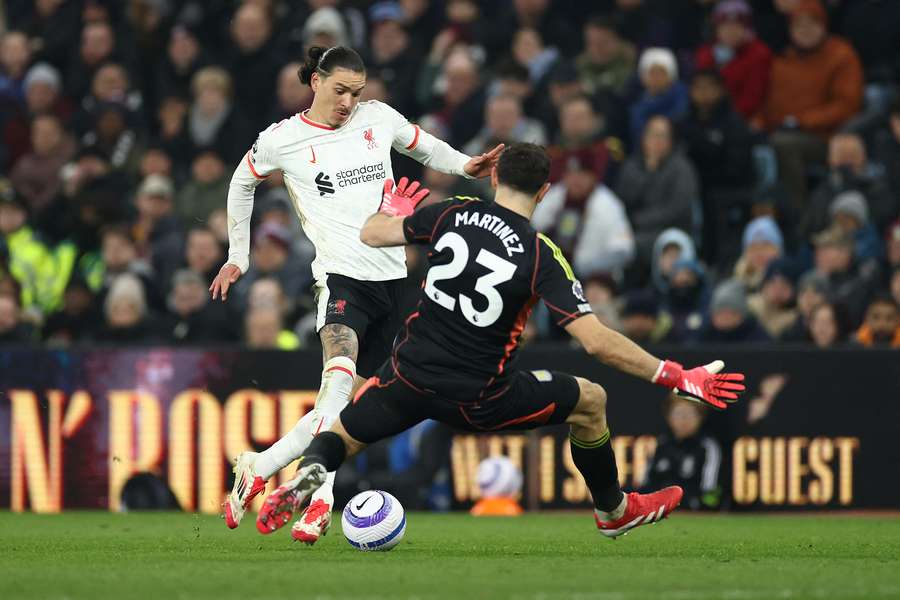 Darwin Nunez is challenged by Emiliano Martinez during Liverpool's 2-2 draw to Aston Villa on Wednesday