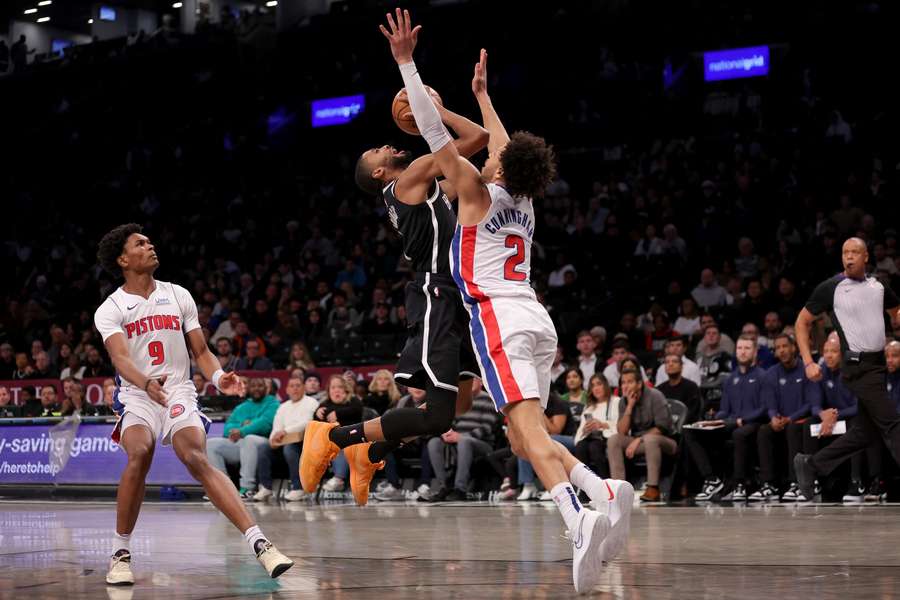 Brooklyn Nets forward Mikal Bridges is fouled as he drives to the basket by Detroit Pistons guard Cade Cunningham 