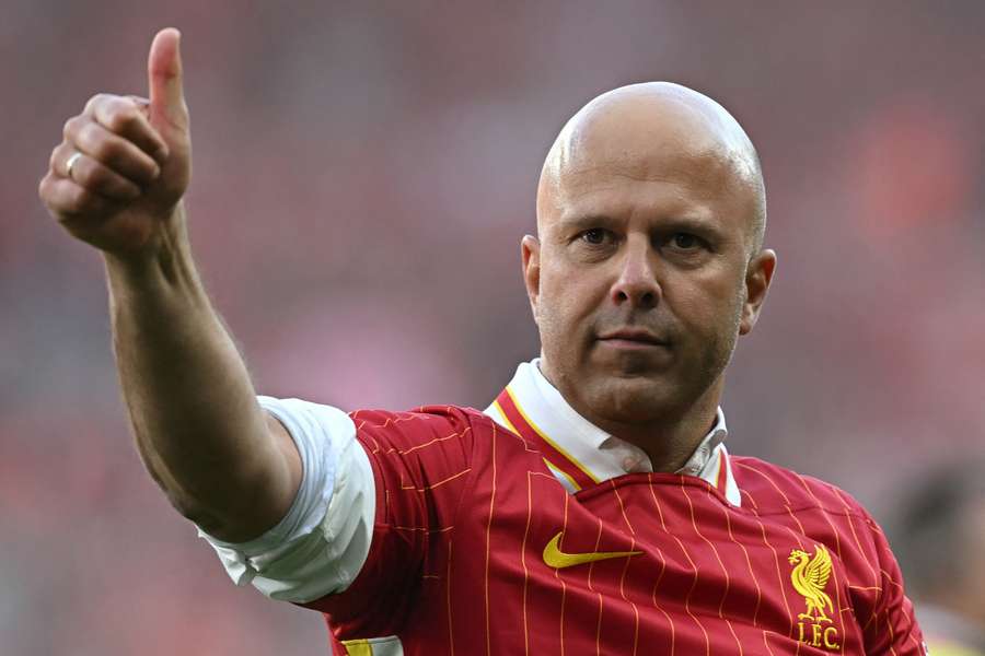 Liverpool's Dutch manager Arne Slot waves to the fans after the match against Tottenham