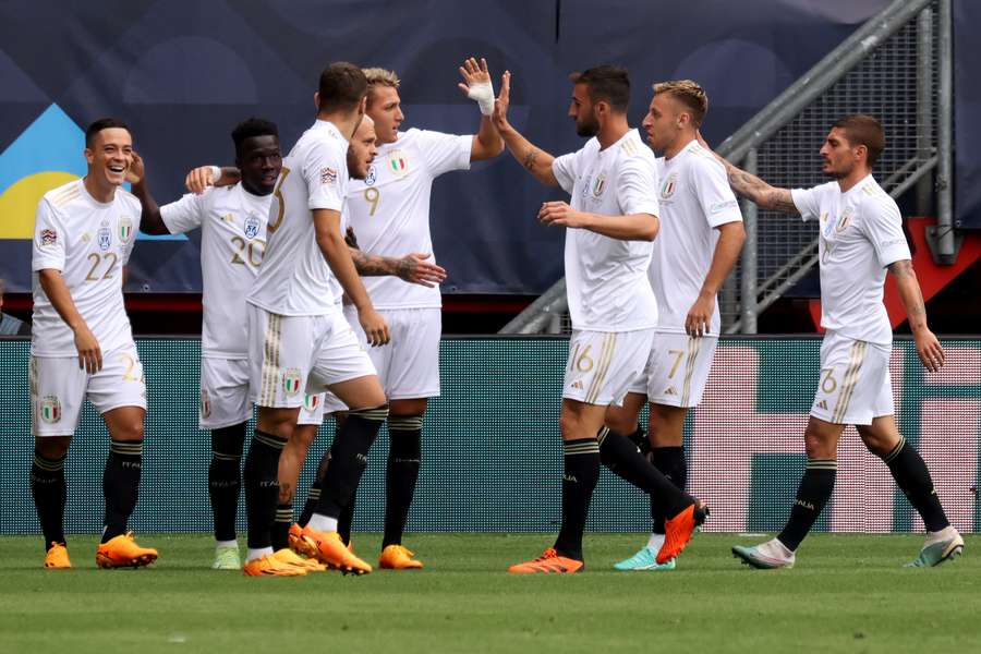 The Italy players celebrate