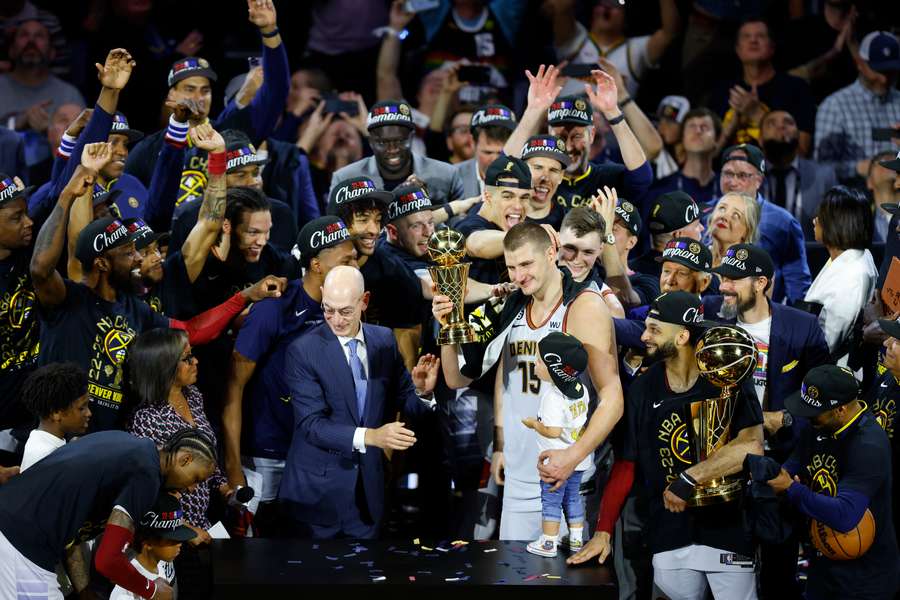 Nikola Jokic #15 of the Denver Nuggets is presented the Bill Russell NBA Finals Most Valuable Player Award