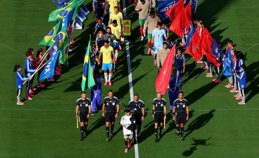 General view as players from both teams walk out onto the pitch before the match General view as players from both teams walk out onto the pitch before the match