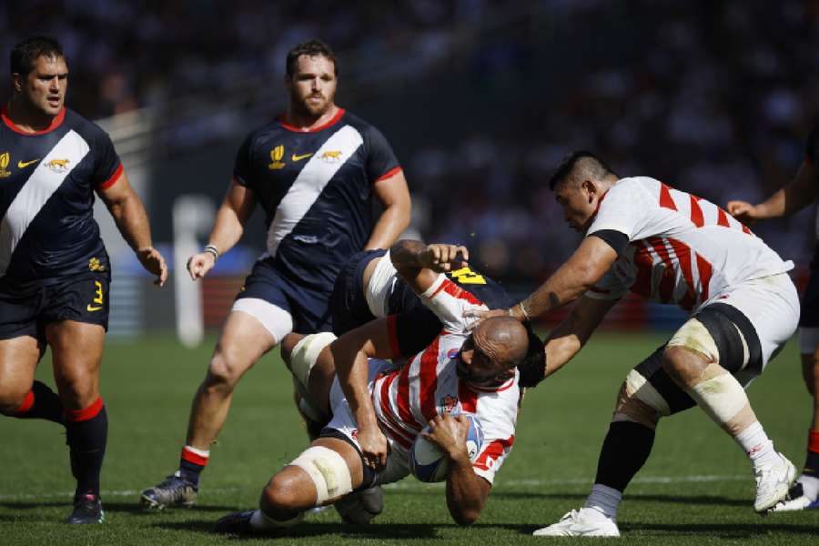 Japan's Michael Leitch in action with Argentina's Juan Martin Gonzalez