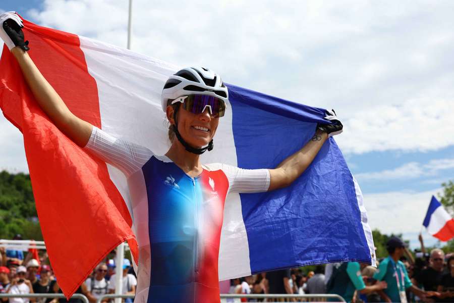 All smiles now for golden Frenchwoman Ferrand-Prevot