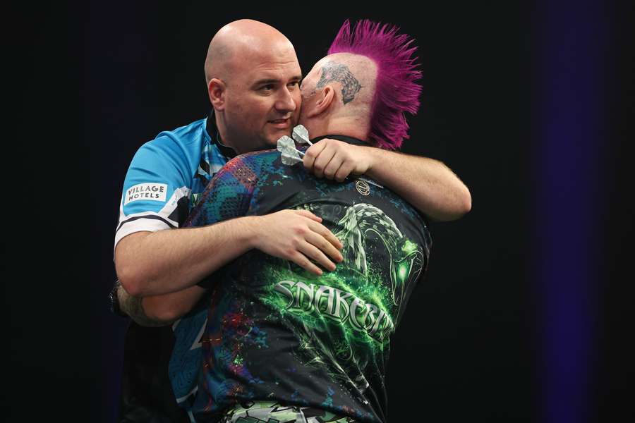 Rob Cross beat Peter Wright on day three of the Grand Slam of Darts