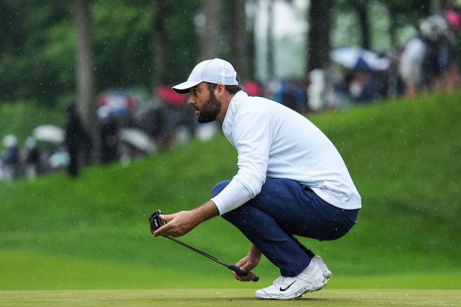 Scottie Scheffler reads the greens at Valhalla