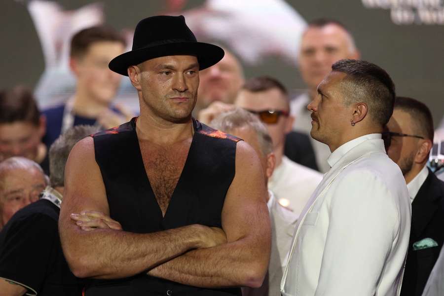 Fury (L) faces off with Usyk