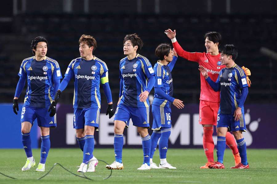 Machida Zelvia players celebrate their victory