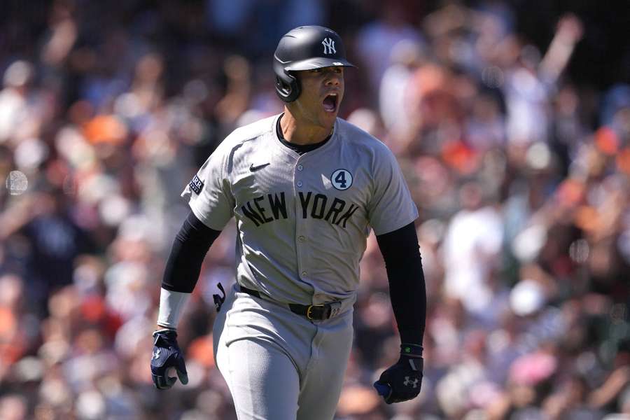 New York Yankees right fielder Juan Soto reacts after hitting a home run against the San Francisco Giants during the ninth inning