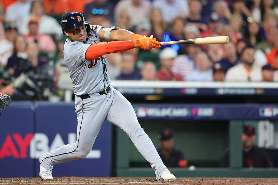 Andy Ibanez of the Detroit Tigers hits a double against the Houston Astros in the third inning