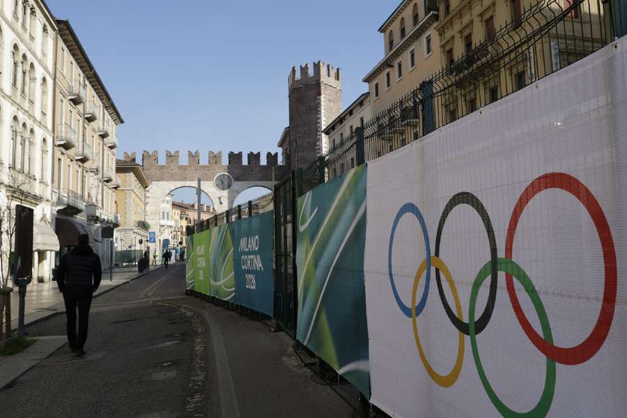 A man walks outside Verona Olympic arena ahead of the closing ceremony in Verona