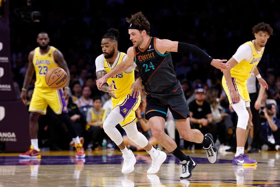 D'Angelo Russell of the Los Angeles Lakers steals the ball from Washington's Corey Kispert during the Lakers' overtime victory
