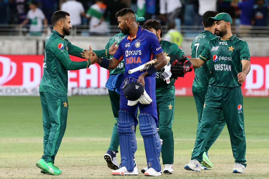 Hardik Pandya shakes hands with Pakistan's players following his knock of 33 not out to win the game for India