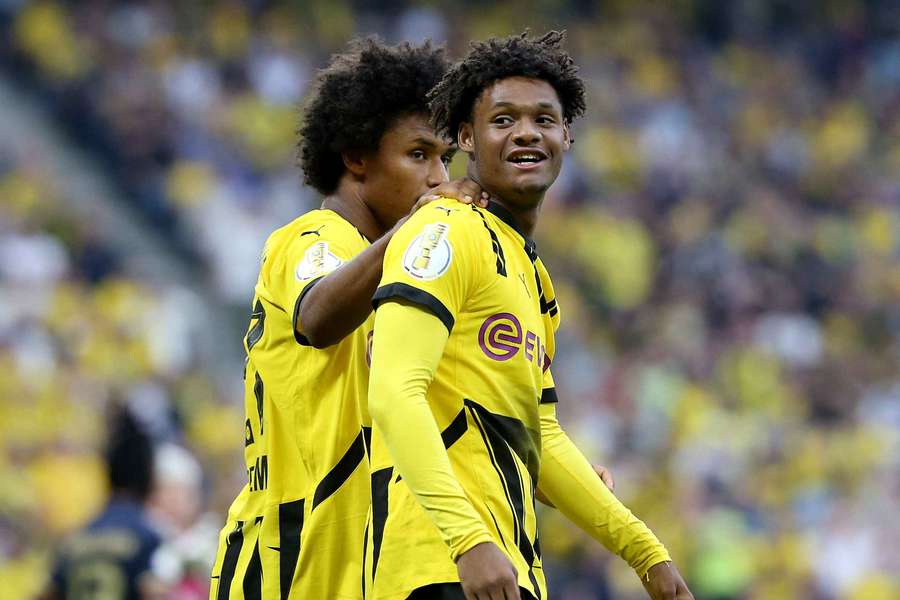 Borussia Dortmund's Julien Duranville celebrates scoring a goal with Karim Adeyemi