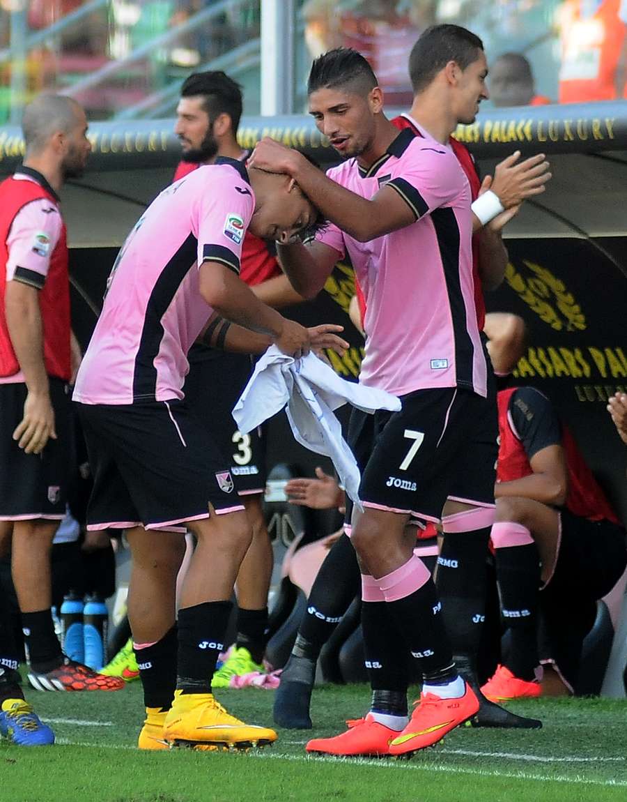 Achraf Lazaar and Paulo Dybala celebrate a Palermo goal.