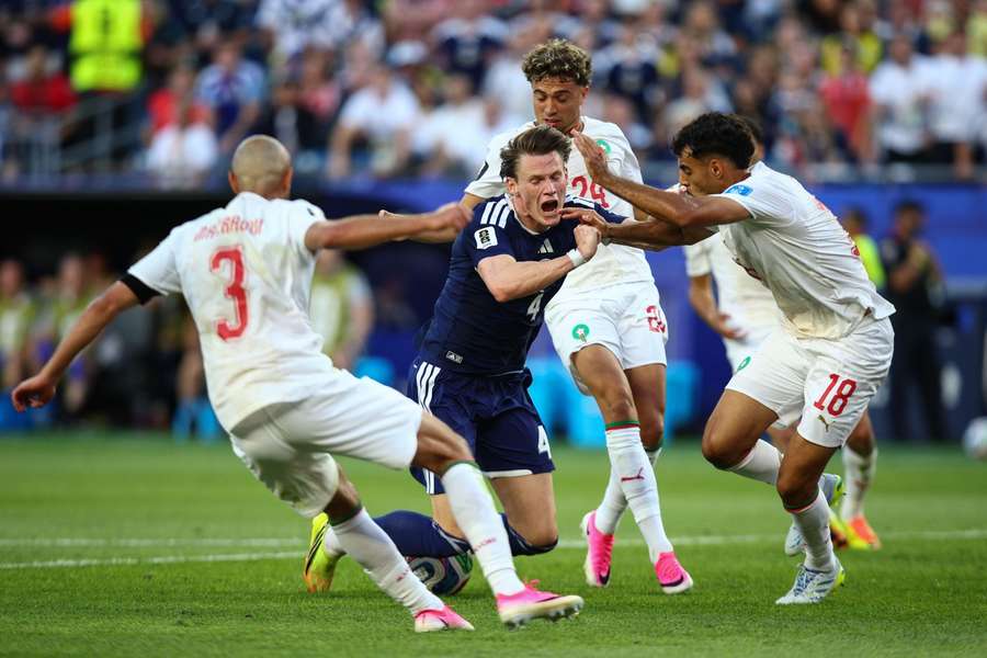 Scotland's Scott McTominay goes down under a challenge from Morocco's El Aynaoui Scotland's Scott McTominay goes down under a challenge from Morocco's El Aynaoui