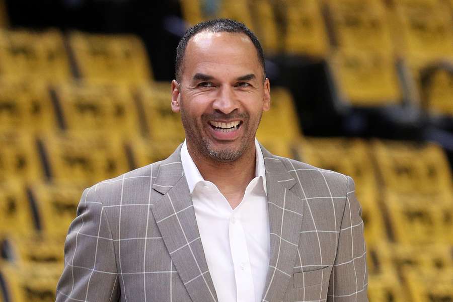 Dallas Mavericks General Manager Nico Collins smiling prior to the team's Play-In game vs. Memphis Grizzlies (2025 NBA Playoffs)