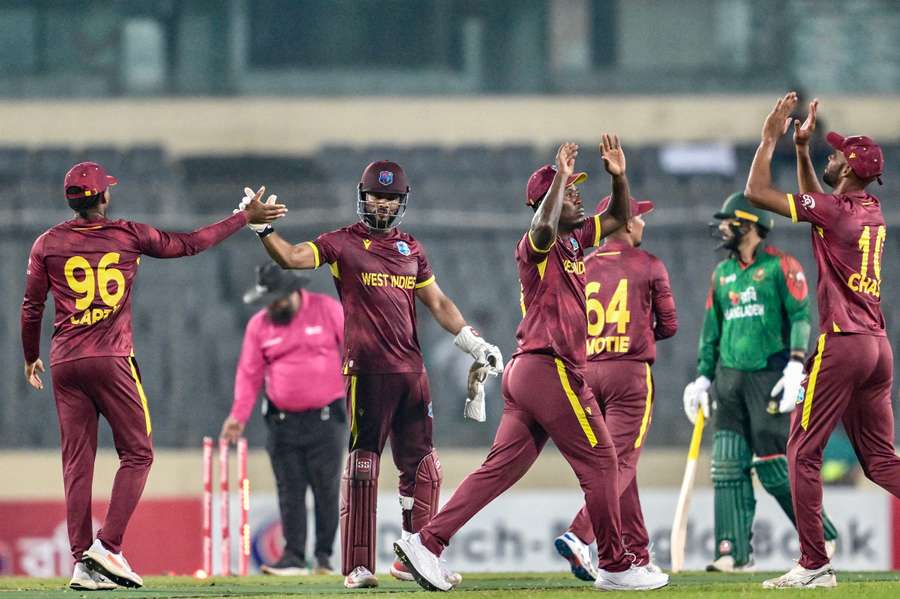 West Indies players celebrate their Super Over victory against Bangladesh in Dhaka.