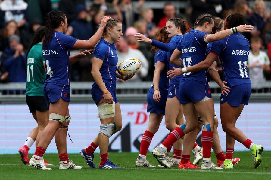 France's wing Joanna Grisez (C) reacts after scoring a try during the Women’s Rugby World Cup quarter-final against Ireland