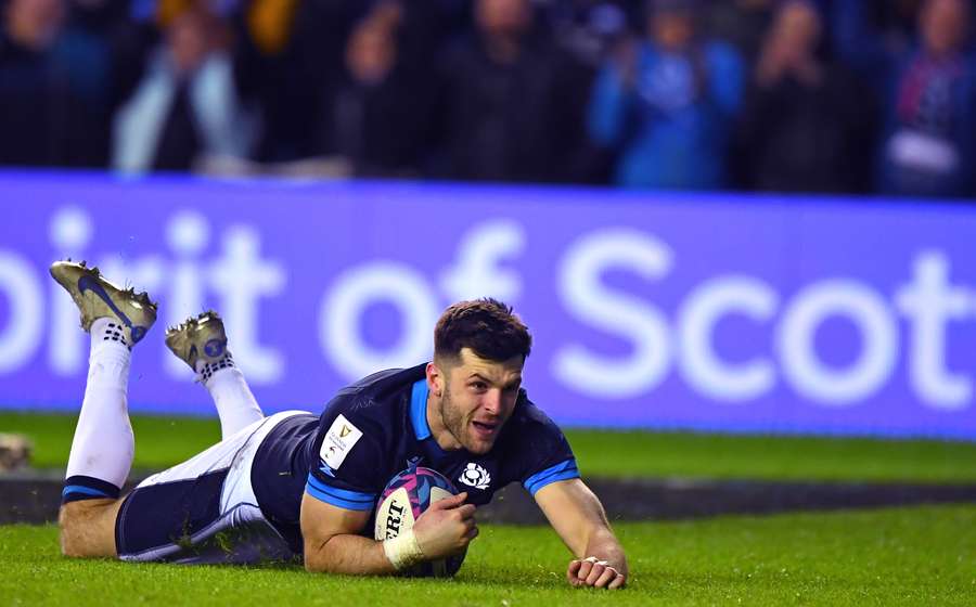 Scotland's Blair Kinghorn dives over the line to score a try during the Six Nations international rugby union match between Scotland and Wales