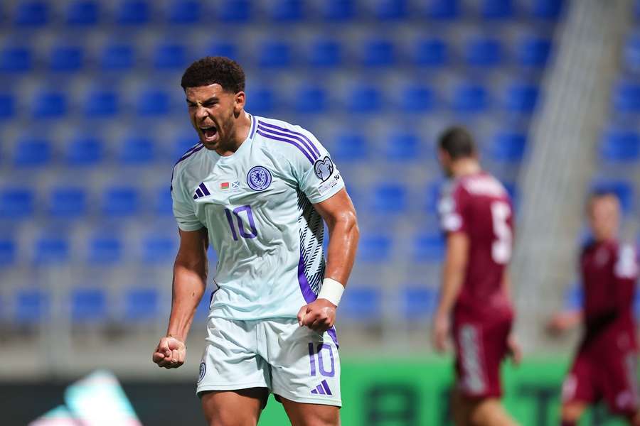 Che Adams celebrates