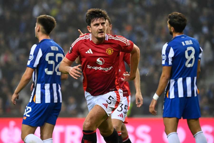 Harry Maguire celebrates scoring Man Utd's equalising goal in injury time