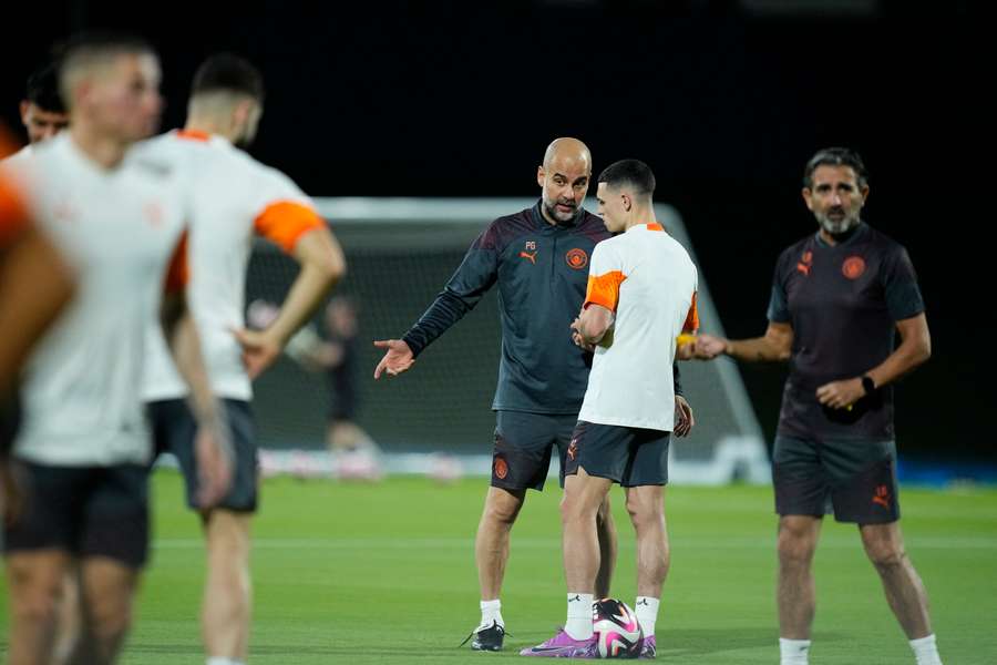 Pep Guardiola leads a training session ahead of Man City's match against Urawa Reds