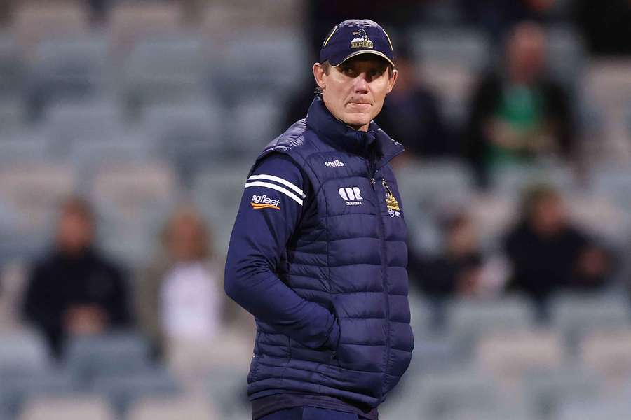 Stephen Larkham watches his ACT Brumbies warm up ahead of their loss to the British & Irish Lions.