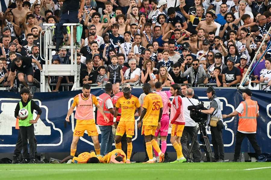 As Rodez players celebrated the goal, a supporter entered the pitch and shoved Buades, who fell to the ground