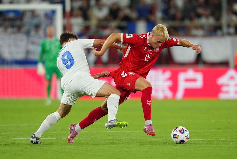 Denmark's Victor Froholdt of Denmark and Christos Tzolis of Greece battle for the ball in the first meeting between the two countries