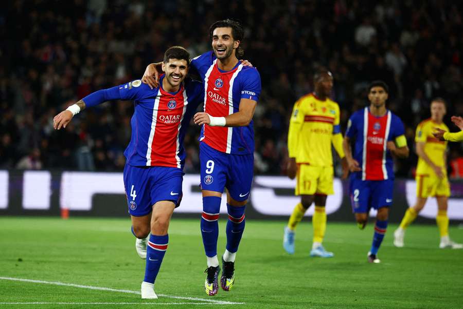 Paris St Germain's Lucas Beraldo celebrates scoring their first goal with Ferran Torres Paris St Germain's Lucas Beraldo celebrates scoring their first goal with Ferran Torres
