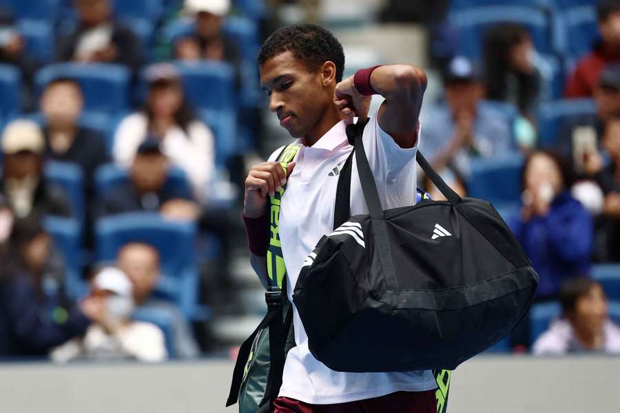 Auger-Aliassime reacts after his defeat