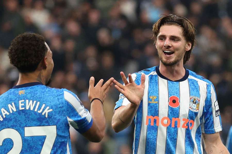 Coventry City's Jack Rudoni celebrates scoring their third goal with Milan van Ewijk