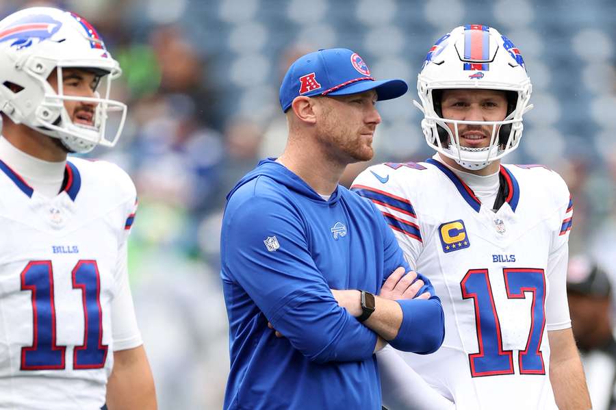 Buffalo Bills offensive coordinator Joe Brady standing alongside quarterback Josh Allen