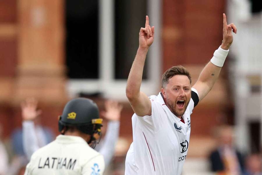 Robinson celebrates one of his wickets for England